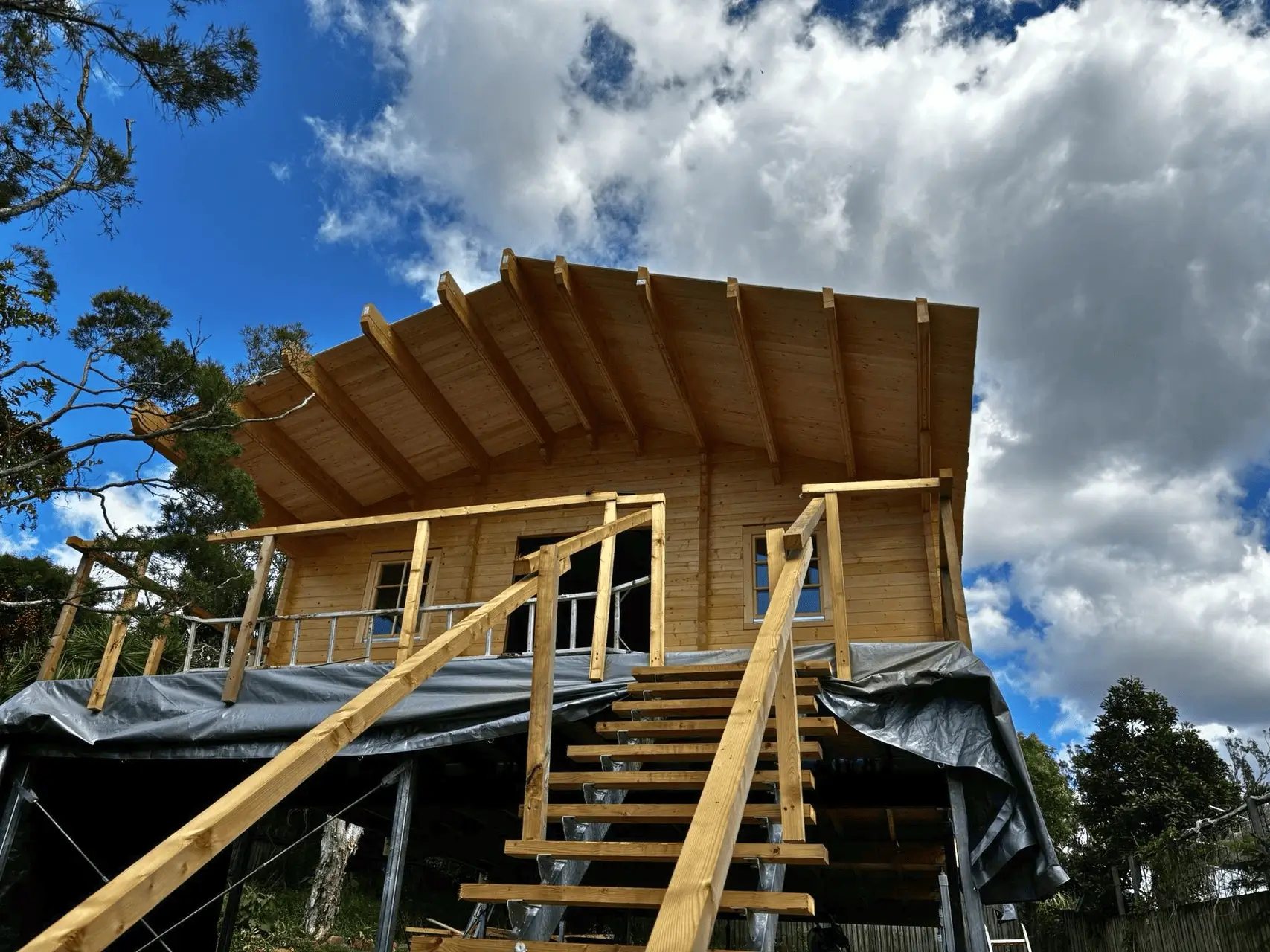 Explore the full timeline of building a timber home, from factory production to on-site assembly. Learn how prefab construction delivers speed, precision, and quality.